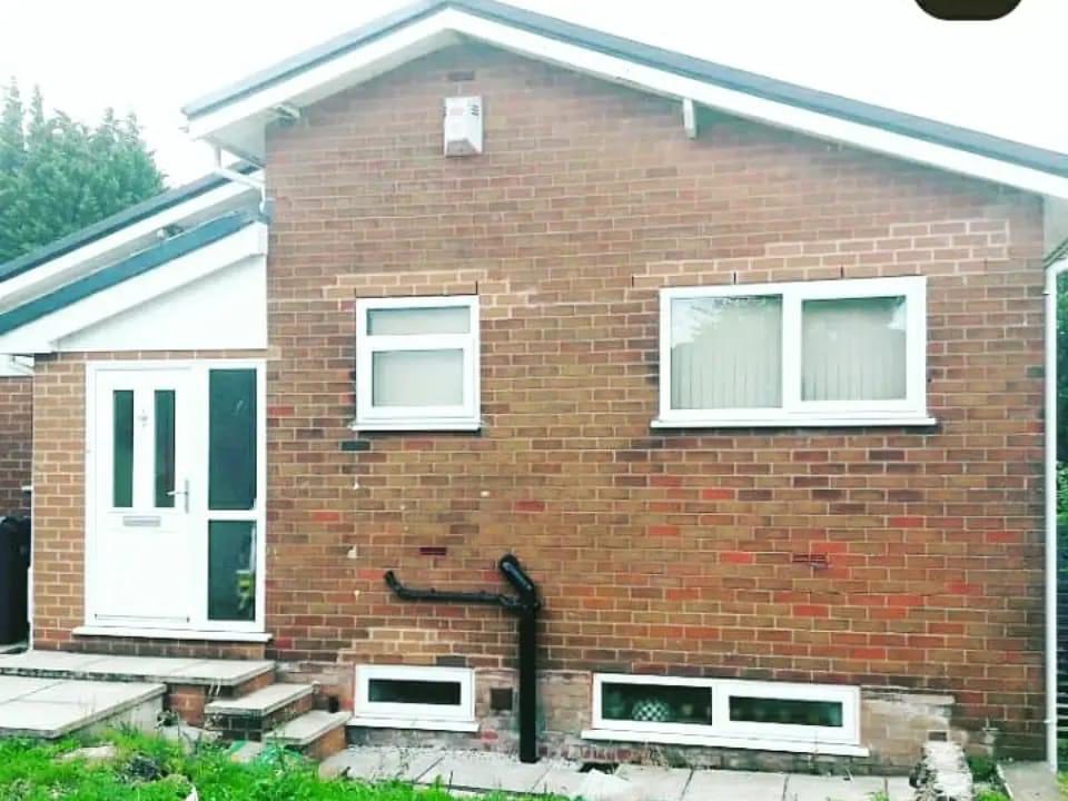 Bungalow before renovation, plain brick exterior
