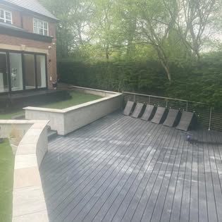 Raised composite decking area with steel balustrade and lounge seating